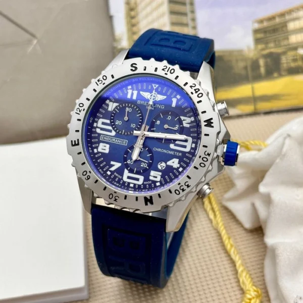 A beautiful and affordable Blue Breitling casual wristwatch featuring a unique large metal dial and a sporty loop strap. Comes with a free box and cufflinks.